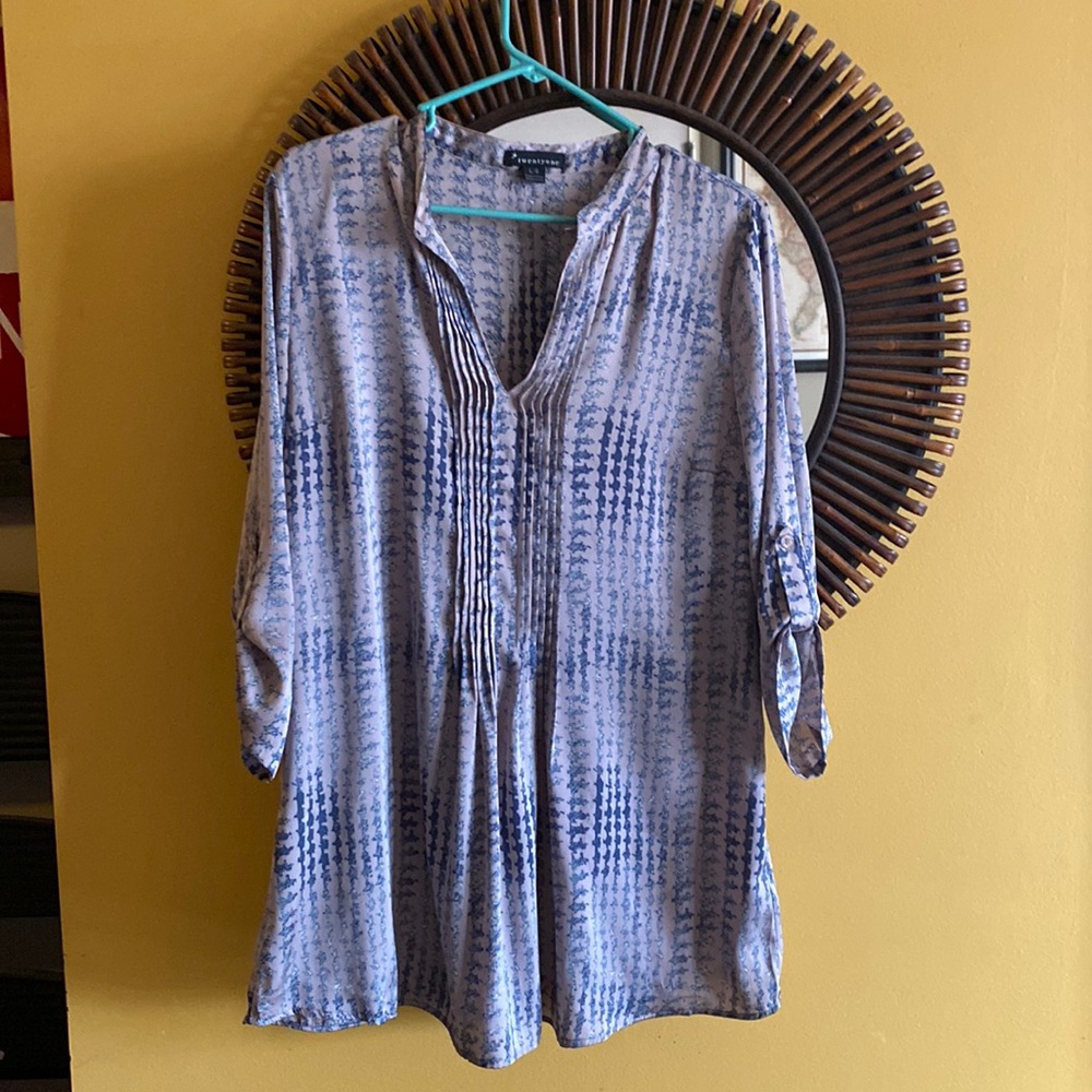 Silk tunic with 3/4 length sleeves. I am 5 ft and it hits above my knees. Size L